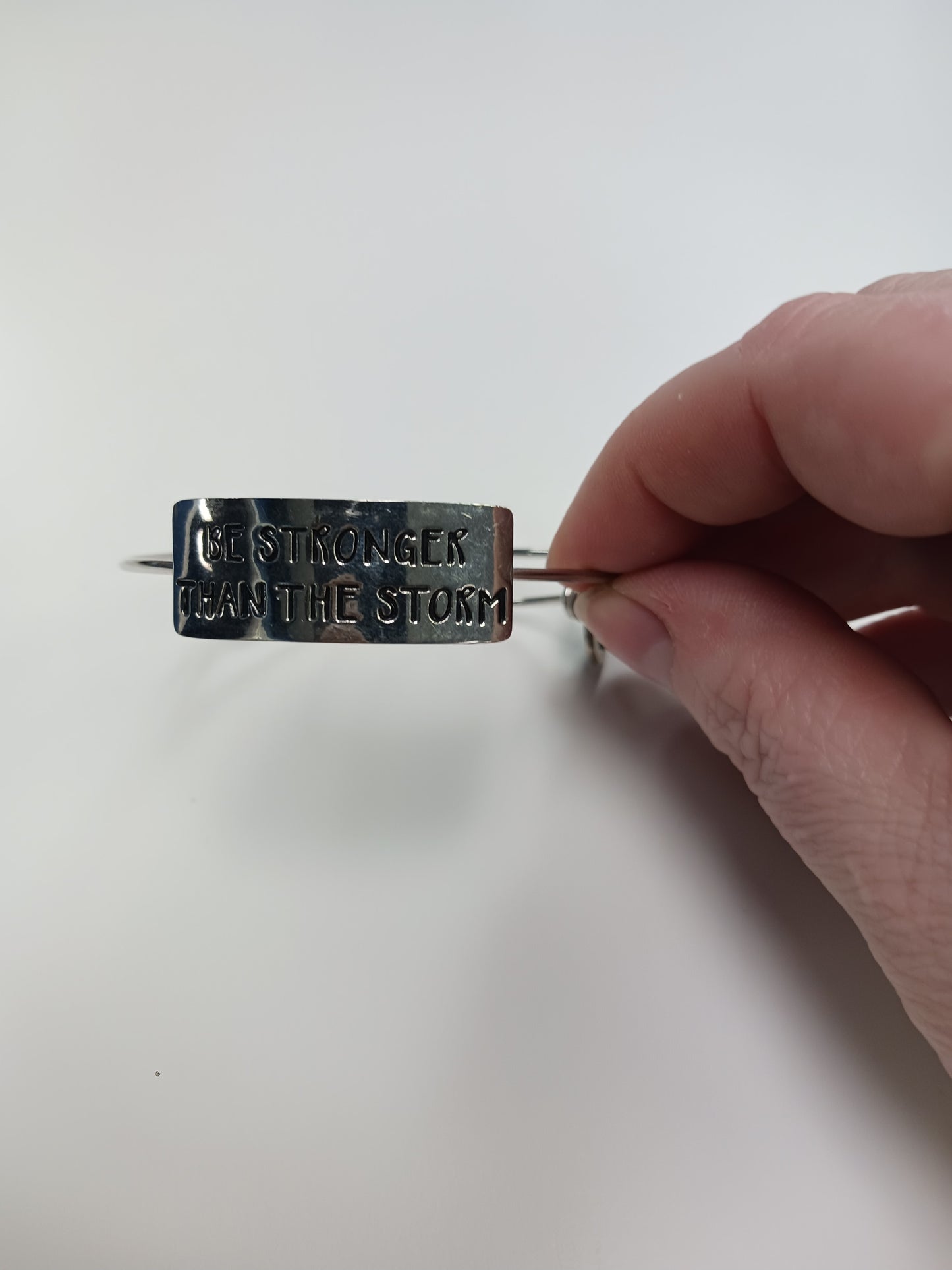 Metal Bracelet. "Be stronger then the storm.